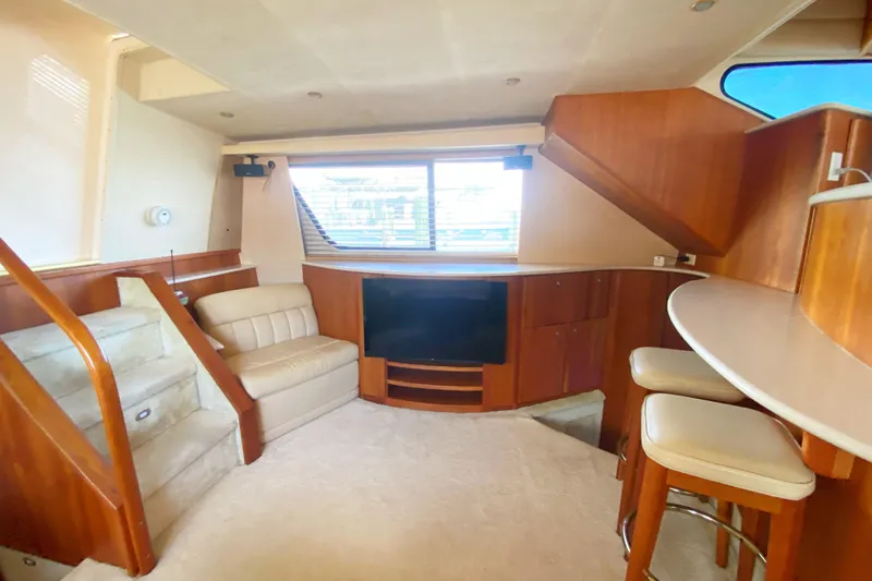 Nauti Boxer Yacht Photos Pics Interior of 2003 Silverton 453 Motor Yacht with cozy seating and modern amenities.