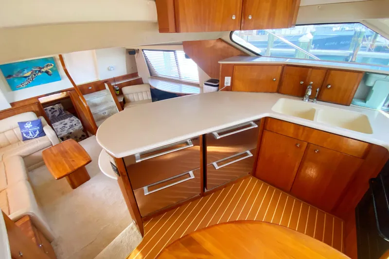 Nauti Boxer Yacht Photos Pics Luxurious interior of 2003 Silverton 453 Motor Yacht with modern kitchen and seating area.