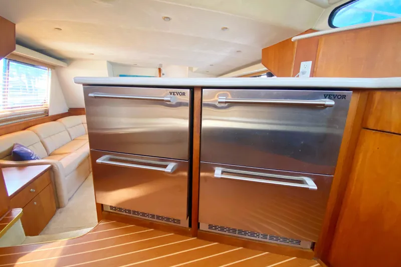 Nauti Boxer Yacht Photos Pics Interior of 2003 Silverton 453 Motor Yacht with stainless steel Vevor appliances.