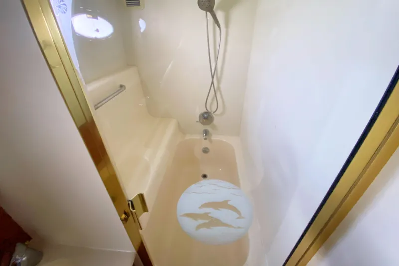 Nauti Boxer Yacht Photos Pics Luxurious bathroom in 2003 Silverton 453 Motor Yacht with shower and dolphin design.