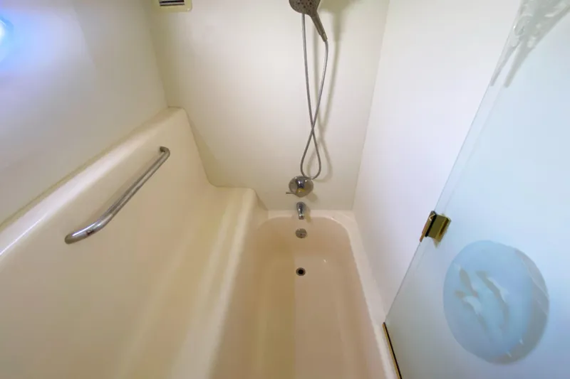 Nauti Boxer Yacht Photos Pics Bathroom with shower and tub in 2003 Silverton 453 Motor Yacht.