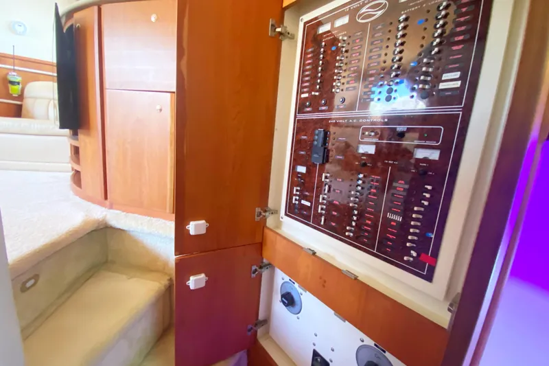 Nauti Boxer Yacht Photos Pics 2003 Silverton 453 Motor Yacht interior with control panel and wooden cabinetry.