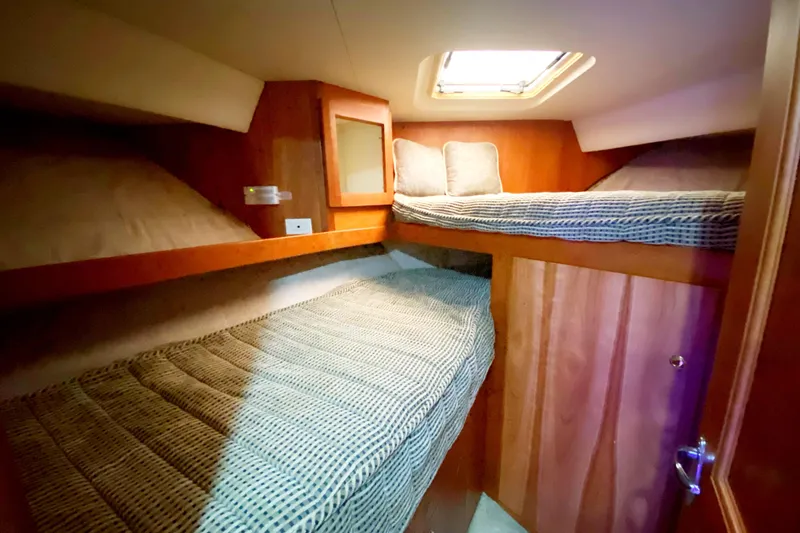 Nauti Boxer Yacht Photos Pics 2003 Silverton 453 Motor Yacht cabin with cozy bunk beds and wooden interior.