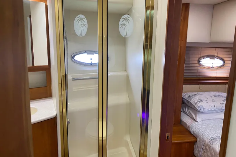 Nauti Boxer Yacht Photos Pics 2003 Silverton 453 Motor Yacht interior with shower and cozy bedroom.