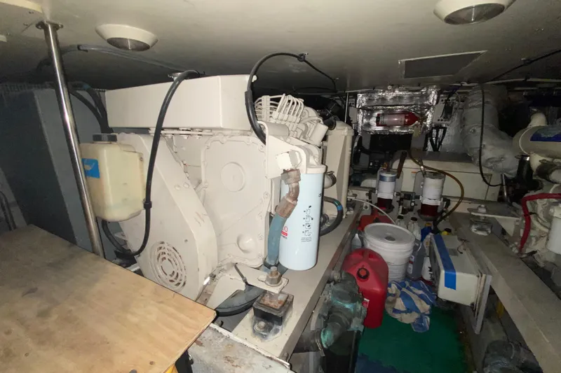 Nauti Boxer Yacht Photos Pics Engine room of a 2003 Silverton 453 Motor Yacht with visible machinery and equipment.