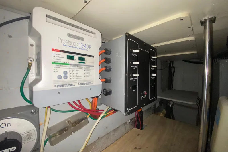 Nauti Boxer Yacht Photos Pics Electrical panel and ProNautic charger in 2003 Silverton 453 Motor Yacht.