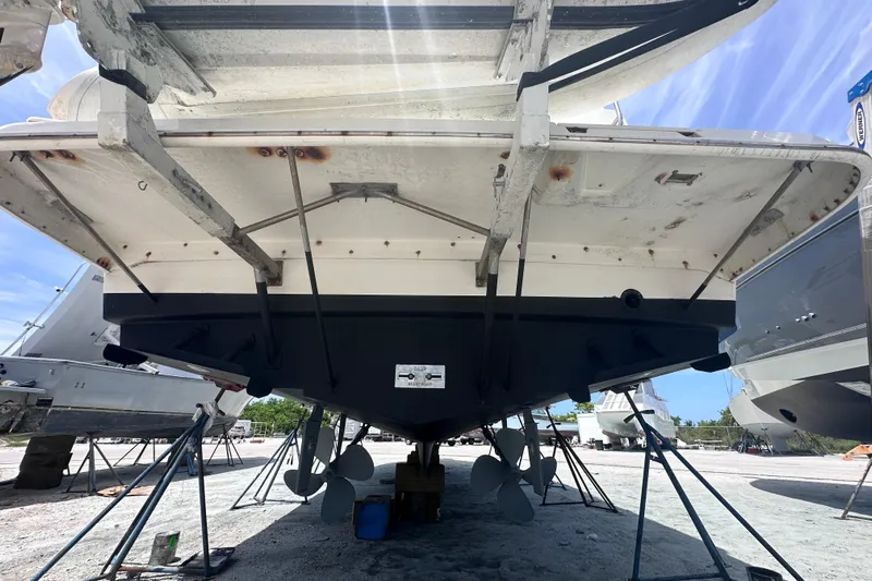 Nauti Boxer Yacht Photos Pics 2003 Silverton 453 Motor Yacht under maintenance, showing hull and propellers.