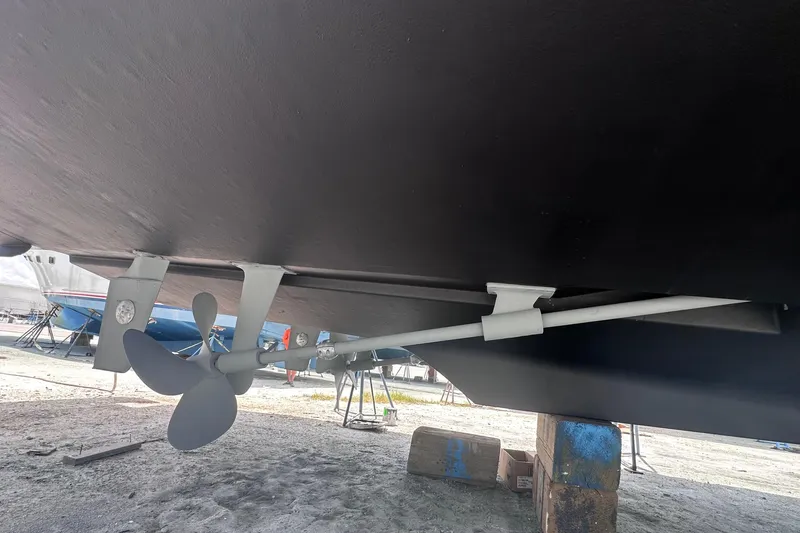 Nauti Boxer Yacht Photos Pics Underneath view of a 2003 Silverton 453 Motor Yacht, showcasing propeller and hull.