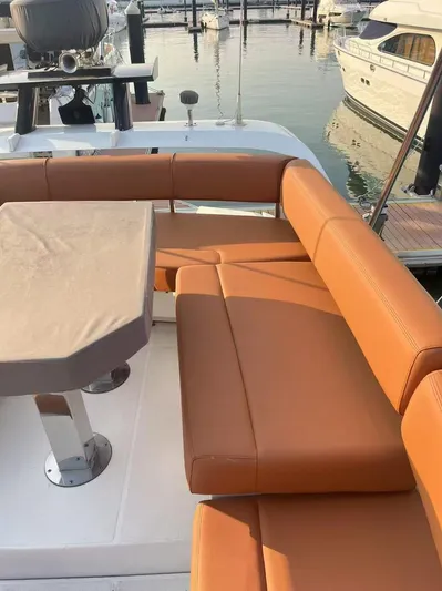  Yacht Photos Pics Luxurious seating on 2011 Marquis 500 Sport Bridge yacht at marina.