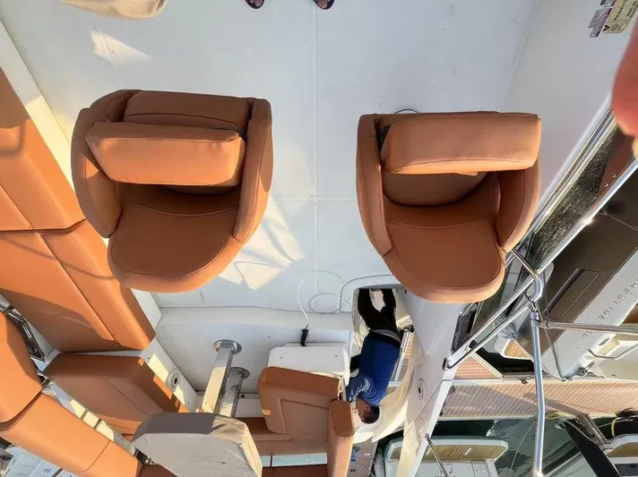  Yacht Photos Pics Interior of 2011 Marquis 500 Sport Bridge yacht with tan leather seating.