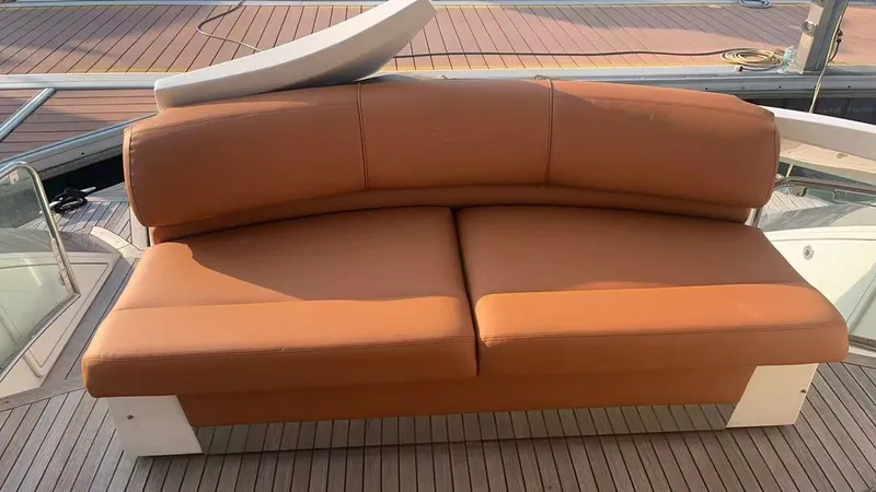  Yacht Photos Pics Brown leather seating on 2011 Marquis 500 Sport Bridge yacht deck.