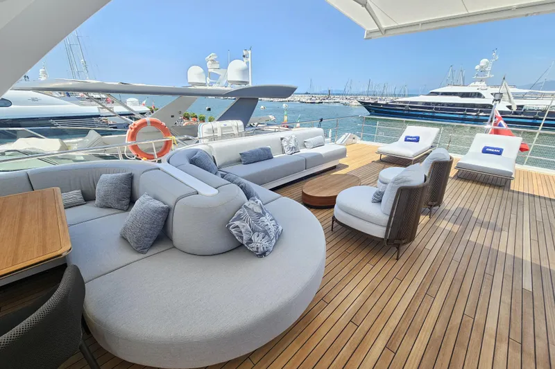 Dream Yacht Photos Pics Luxurious deck of 2024 Azimut Grande 32 Metri yacht with elegant seating and ocean view.