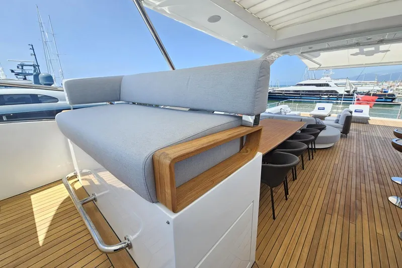 Dream Yacht Photos Pics Luxurious deck of 2024 Azimut Grande 32 Metri yacht with elegant seating and dining area.