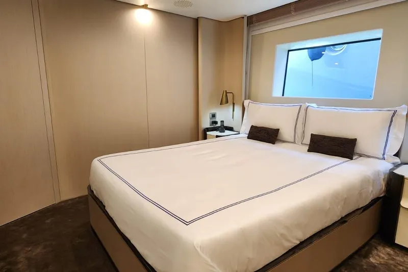 Dream Yacht Photos Pics Luxurious bedroom interior of 2024 Azimut Grande 32 Metri yacht with elegant bedding.