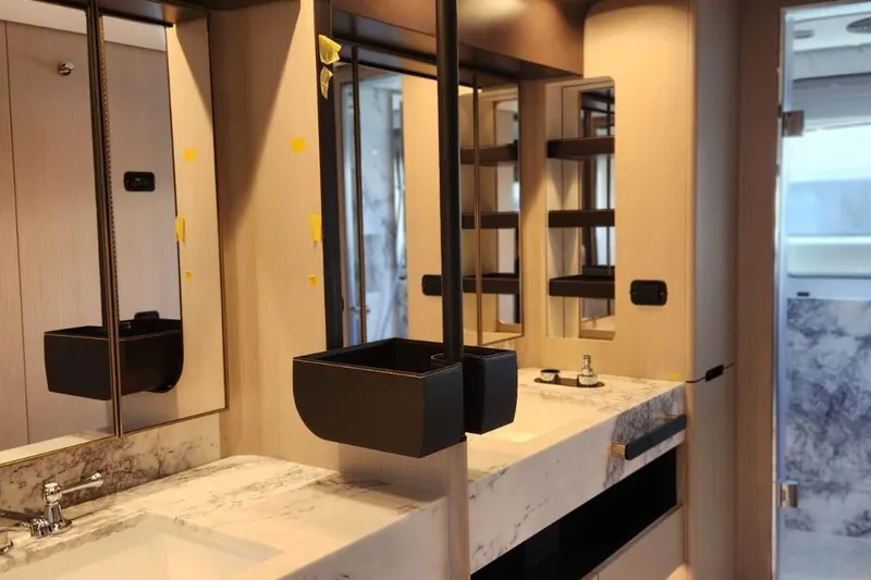 Dream Yacht Photos Pics Luxurious bathroom interior of 2024 Azimut Grande 32 Metri yacht with modern fixtures.