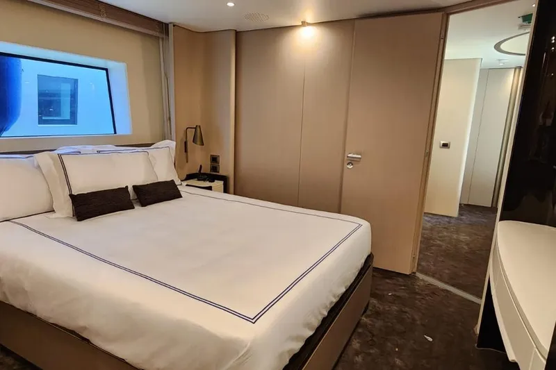 Dream Yacht Photos Pics Luxurious bedroom interior of 2024 Azimut Grande 32 Metri yacht, featuring elegant design and modern amenities.