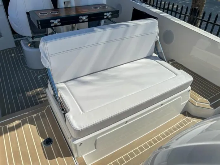  Yacht Photos Pics 2024 Windy SR28 CC boat with white cushioned seating and wooden deck.