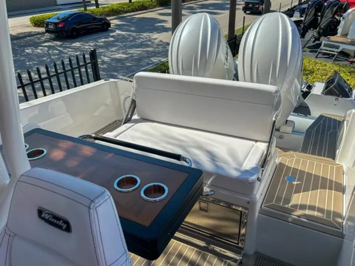  Yacht Photos Pics 2024 Windy SR28 CC boat interior with seating and dual outboard motors.