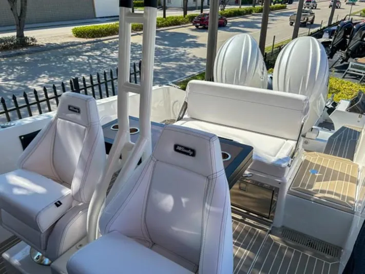  Yacht Photos Pics 2024 Windy SR28 CC boat interior with white seating and dual outboard motors.