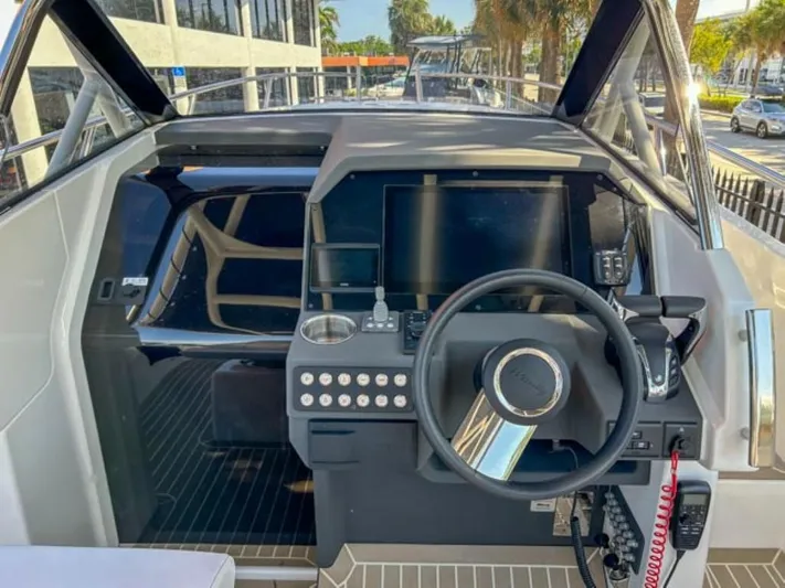  Yacht Photos Pics 2024 Windy SR28 CC boat cockpit with steering wheel and control panel.