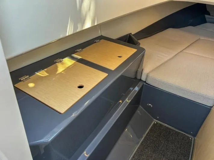  Yacht Photos Pics Interior cabin of 2024 Windy SR28 CC boat with seating and storage compartments.