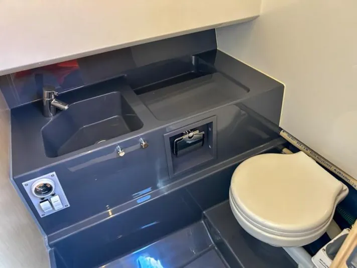  Yacht Photos Pics 2024 Windy SR28 CC boat bathroom with sink and toilet.