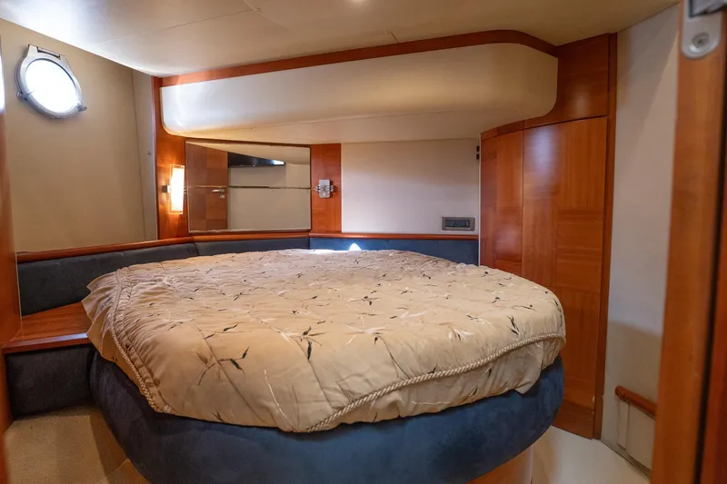 360 Yacht Photos Pics Luxurious bedroom interior of 2008 Azimut 50 Flybridge yacht with cozy bedding.