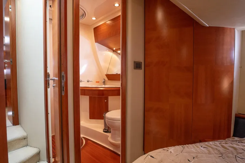 360 Yacht Photos Pics Luxurious 2008 Azimut 50 Flybridge yacht interior with elegant wood finishes and modern bathroom.