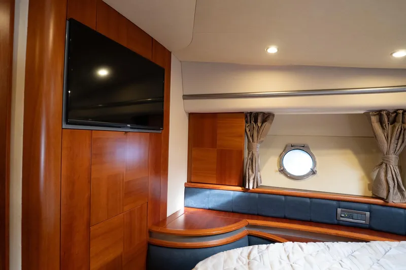 360 Yacht Photos Pics Luxurious 2008 Azimut 50 Flybridge yacht interior with wood paneling and porthole window.