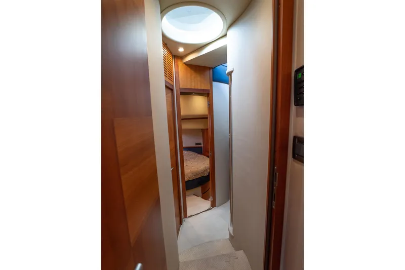 360 Yacht Photos Pics Interior hallway of 2008 Azimut 50 Flybridge yacht with wood paneling and cozy cabin.