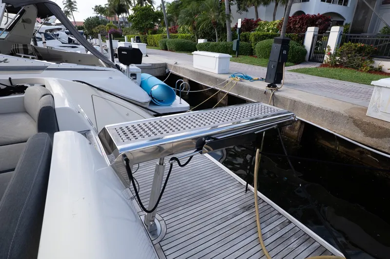 360 Yacht Photos Pics 2008 Azimut 50 Flybridge yacht docked, featuring a sleek gangway and luxurious seating.