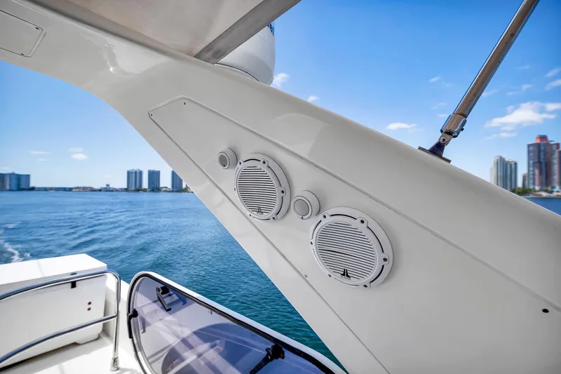 360 Yacht Photos Pics 2008 Azimut Fly 50 yacht speakers with ocean and city skyline backdrop.