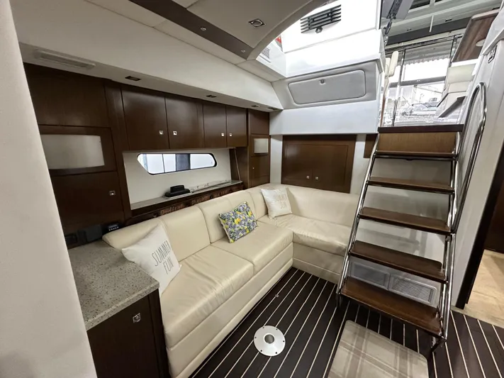 Radical Physics Yacht Photos Pics Luxurious interior of 2012 Cruisers Yachts 48 Cantius with elegant seating and wooden accents.