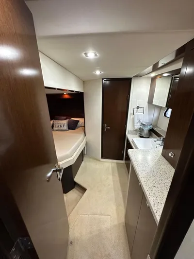 Radical Physics Yacht Photos Pics Interior of 2012 Cruisers Yachts 48 Cantius, featuring a cozy cabin and modern amenities.