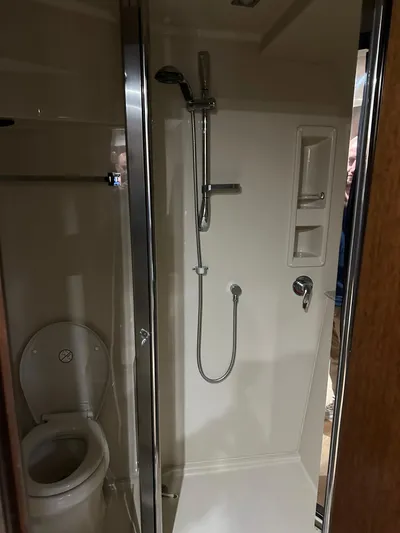 Radical Physics Yacht Photos Pics Bathroom interior of 2012 Cruisers Yachts 48 Cantius with shower and toilet.