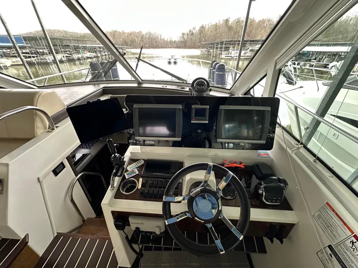 Radical Physics Yacht Photos Pics 2012 Cruisers Yachts 48 Cantius helm with dual screens and modern controls.