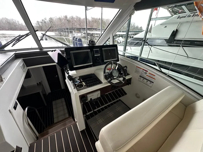 Radical Physics Yacht Photos Pics Helm of 2012 Cruisers Yachts 48 Cantius with modern navigation equipment.