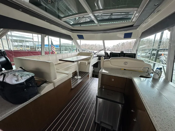 Radical Physics Yacht Photos Pics Interior of 2012 Cruisers Yachts 48 Cantius with seating and helm station.