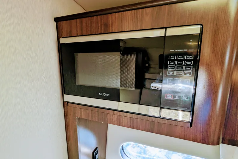  Yacht Photos Pics Built-in microwave in 2018 Regal 33 XO boat interior.