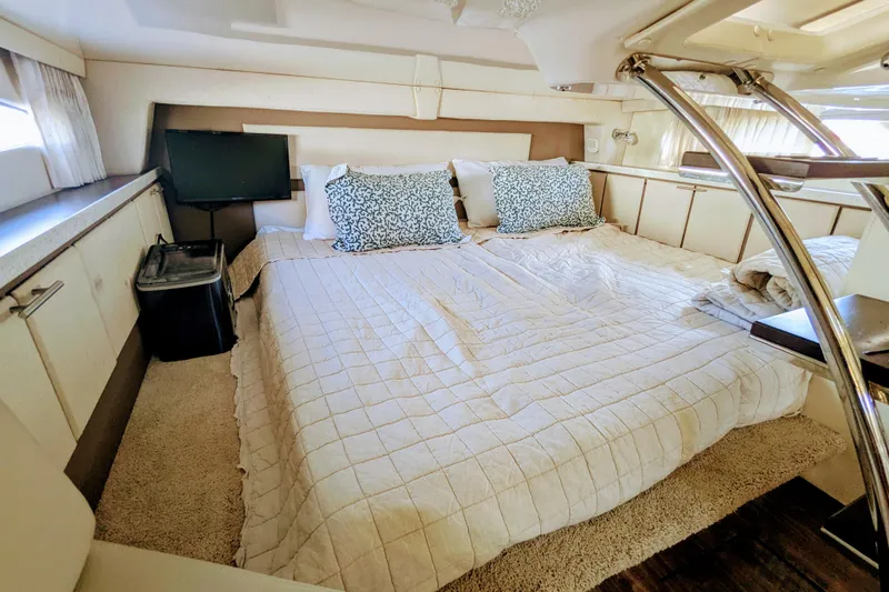  Yacht Photos Pics Luxurious interior cabin of 2018 Regal 33 XO yacht with cozy bedding and modern decor.