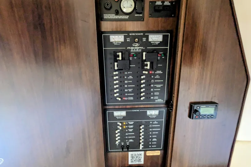  Yacht Photos Pics Electrical control panel of a 2018 Regal 33 XO boat, featuring various switches and gauges.