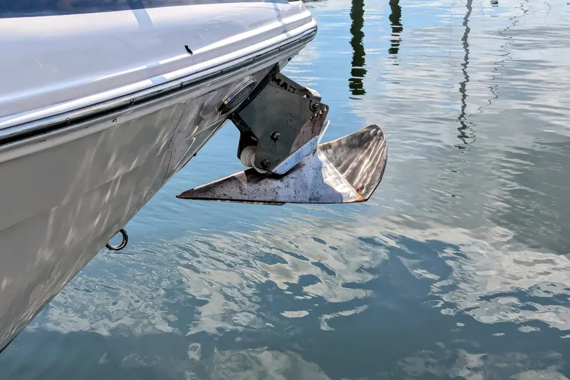  Yacht Photos Pics 2018 Regal 33 XO boat anchor above water, reflecting sunlight.