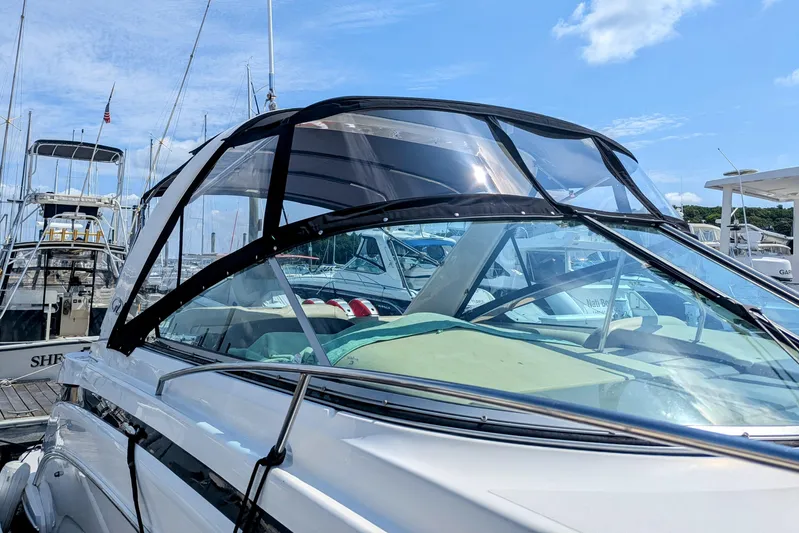  Yacht Photos Pics 2018 Regal 33 XO boat docked at marina under clear blue sky.