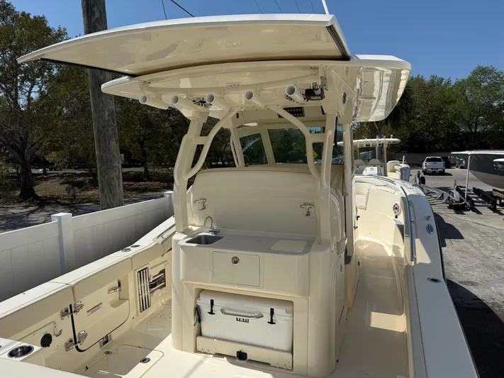  Yacht Photos Pics 2025 Scout 330 LXF boat with spacious deck and modern amenities.