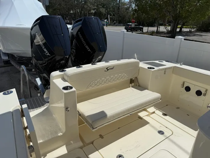  Yacht Photos Pics 2025 Scout 330 LXF boat with dual Mercury engines and spacious seating area.