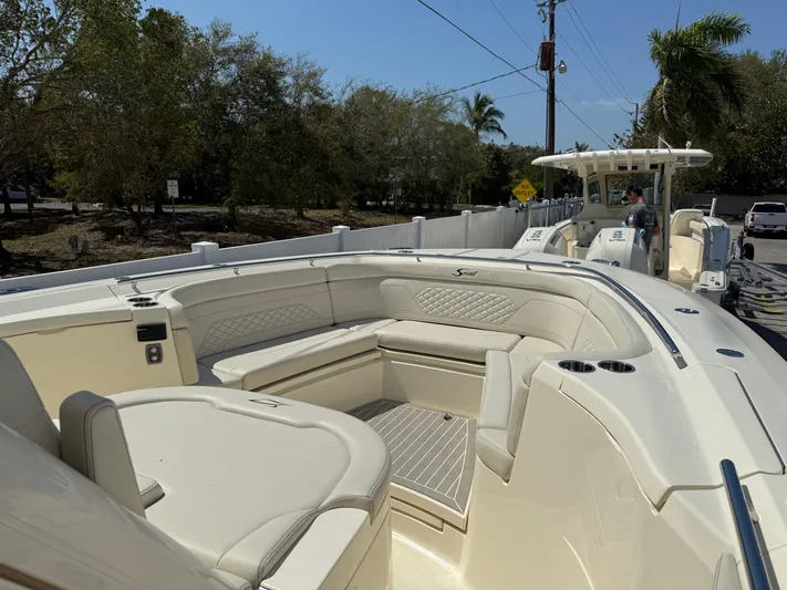  Yacht Photos Pics 2025 Scout 330 LXF boat with luxurious seating and sleek design.