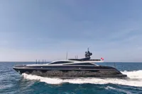 Luxurious 2007 Codecasa 41S yacht cruising on open sea under clear blue sky.