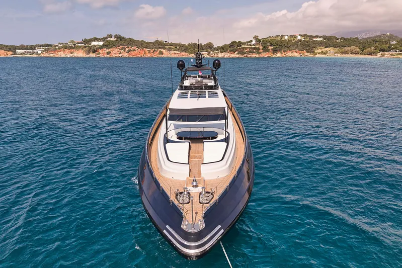 Ability Yacht Photos Pics Luxurious 2007 Codecasa 41S yacht on serene blue waters, coastal landscape in background.