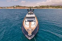 Luxurious 2007 Codecasa 41S yacht on serene blue waters, coastal landscape in background.