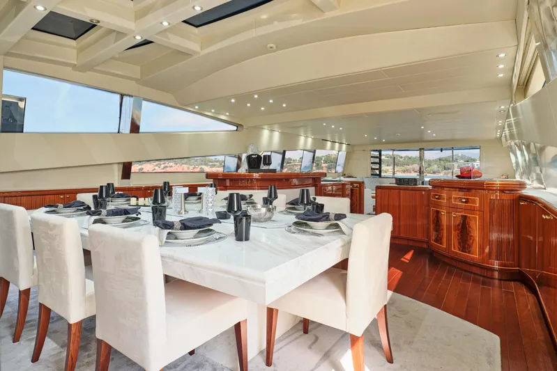 Ability Yacht Photos Pics Luxurious dining area on a 2007 Codecasa 41S yacht with elegant table setting.